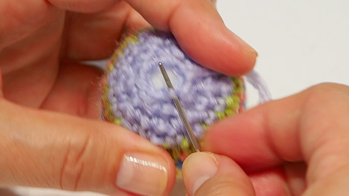 Pick up the stitch before the slip stitch.